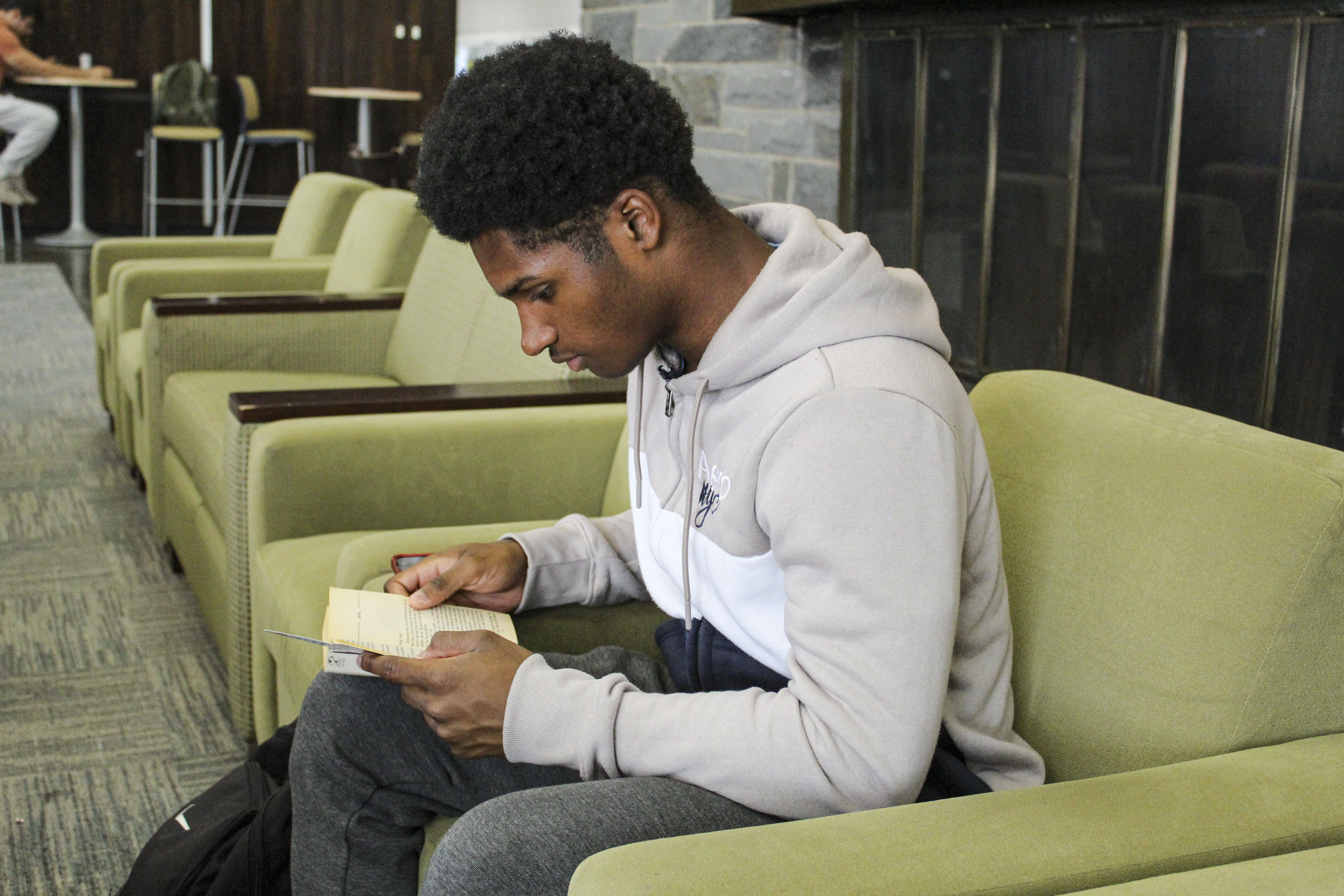 Student reads during Banned Books Week 2025 Event.