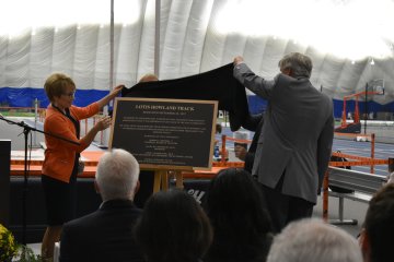 President Laura Casamento reveals a plaque dedicating the track as the Lotis Howland Track.